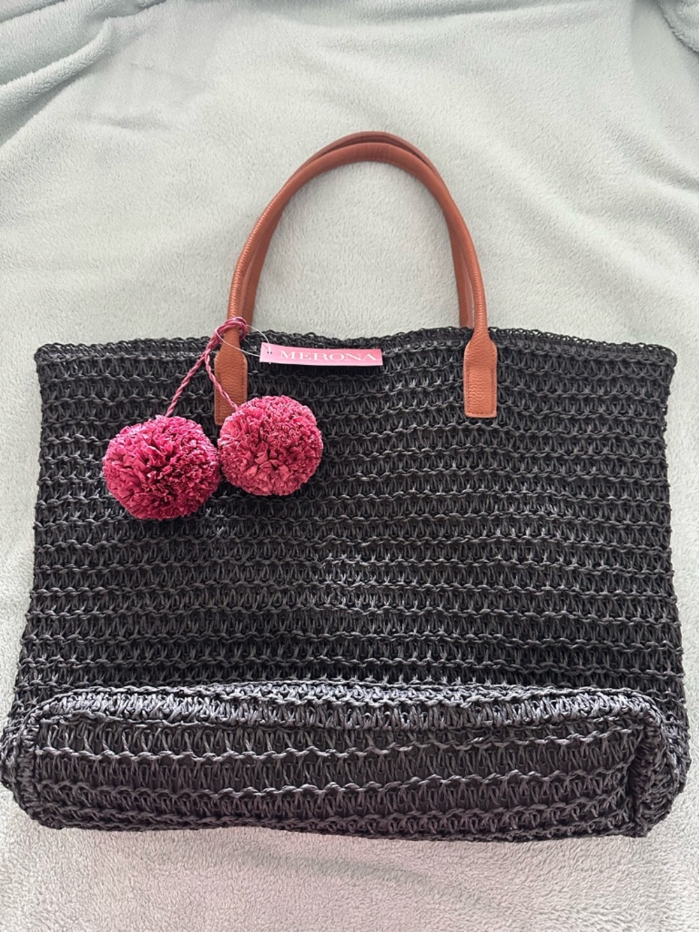 Merona black shoulder bag with brown handles and decorative burgundy balls.